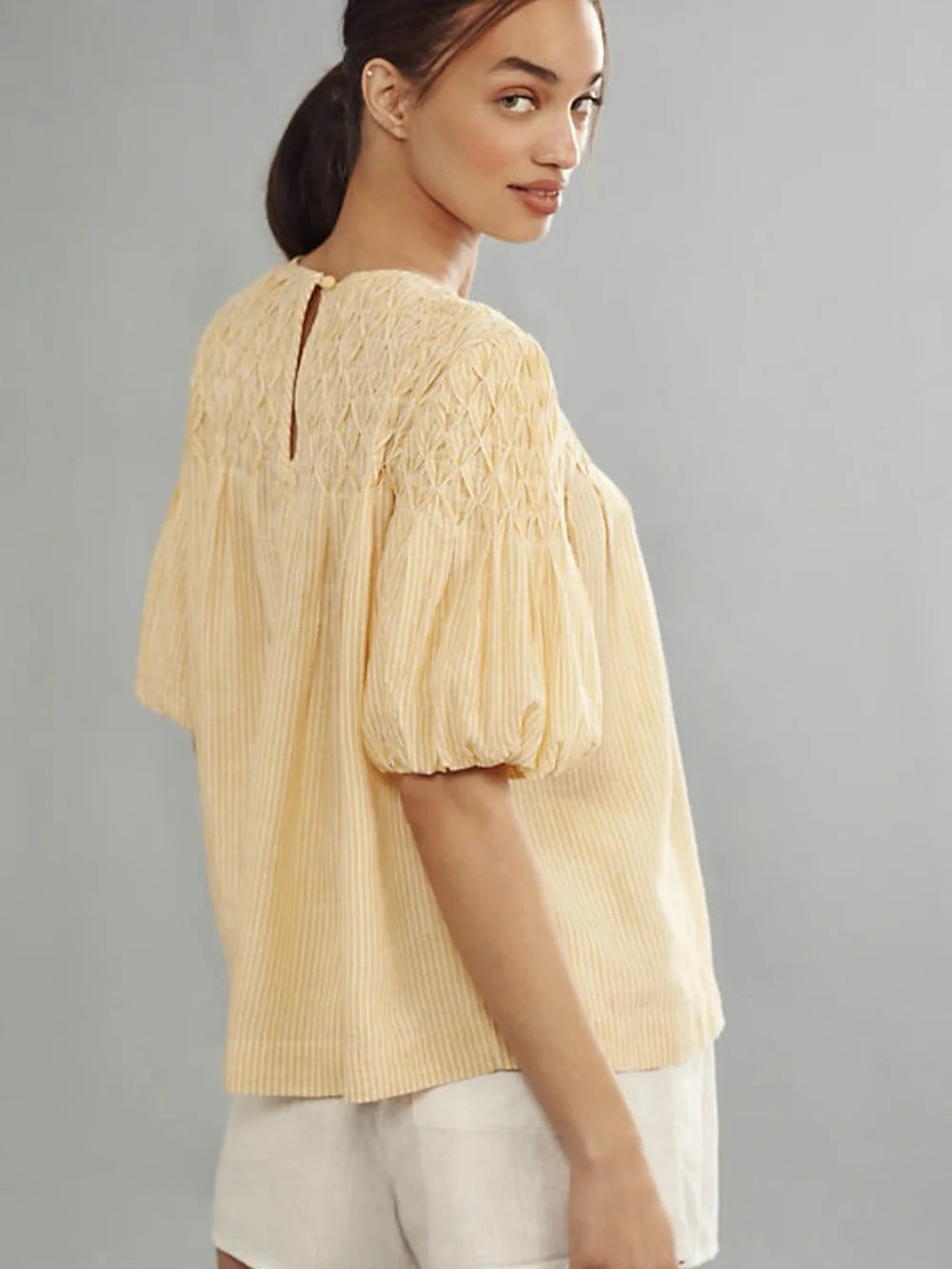 Anthropologie Liza Linen Blend Smocked Top in yellow and white stripe